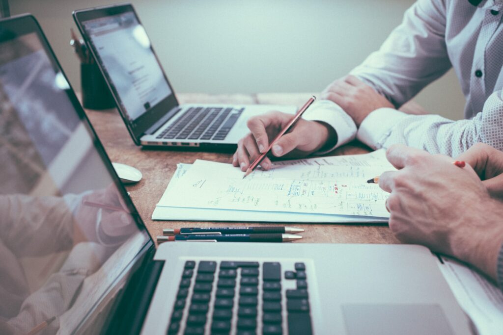 Brainstorming over paper. Photo by Scott Graham on Unsplash